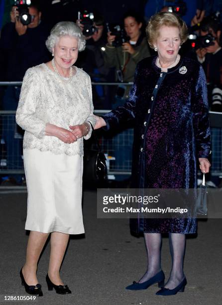 Queen Elizabeth II is greeted by former Prime Minister Baroness Margaret Thatcher as they attend Margaret Thatcher's 80th birthday party at the...