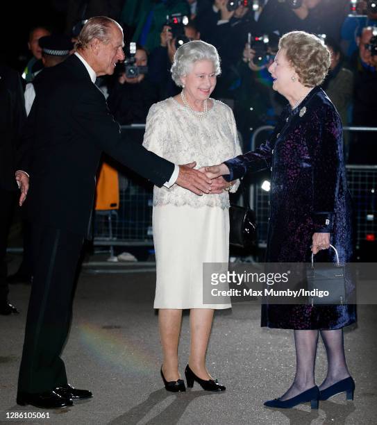 Prince Philip, Duke of Edinburgh and Queen Elizabeth II are greeted by former Prime Minister Baroness Margaret Thatcher as they attend Margaret...