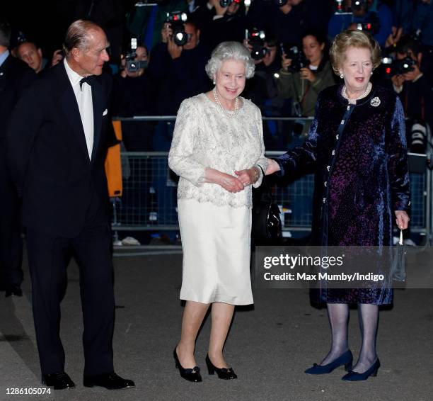 Prince Philip, Duke of Edinburgh and Queen Elizabeth II are greeted by former Prime Minister Baroness Margaret Thatcher as they attend Margaret...