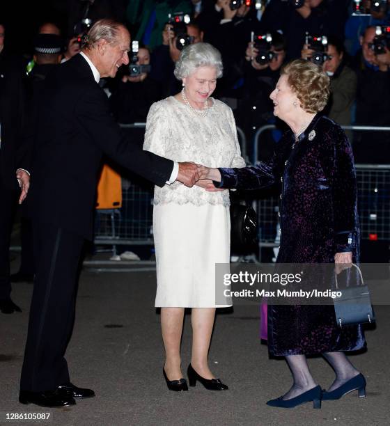 Prince Philip, Duke of Edinburgh and Queen Elizabeth II are greeted by former Prime Minister Baroness Margaret Thatcher as they attend Margaret...