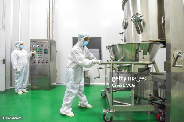 Workers produce bioactive peptides at a workshop of Hubei Reborn Biotech Co., Ltd on November 17, 2020 in Jingzhou, Hubei Province of China.
