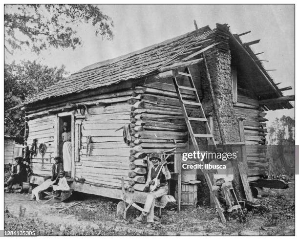 antique black and white photo of the united states: southern usa family - banjo stock illustrations