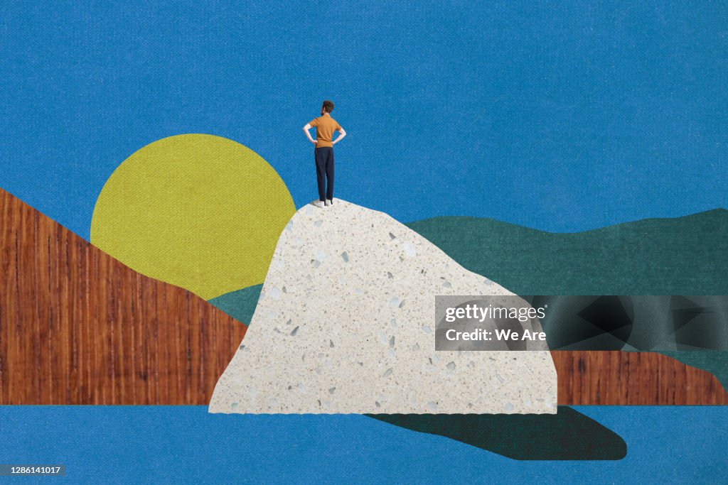 Man standing on top of mountain