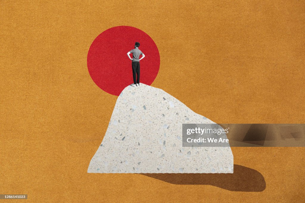 Man standing on top of mountain