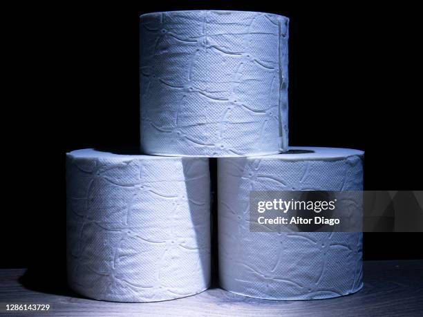 toilet papers against a black background. - traveler's diarrhoea stock pictures, royalty-free photos & images