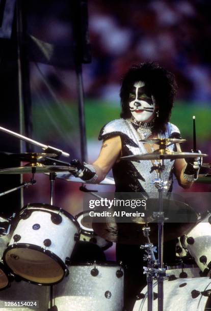 Peter Criss and The rock band Kiss perform during the Super Bowl XXXIII Pregame Show at Pro Player Stadium on January 31, 1999 in Miami Gardens,...