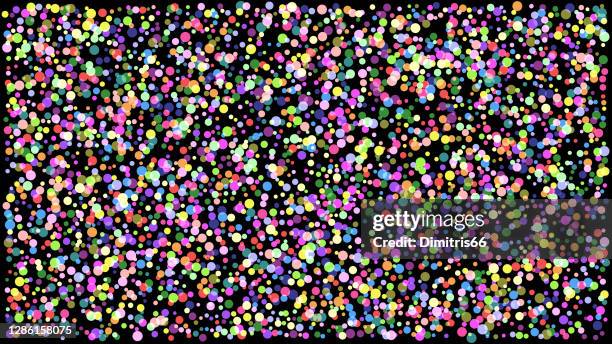abstract colorful background. illuminated color dots on dark space - confetti explosion stock illustrations