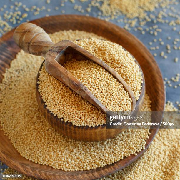 high angle view of wheat in bowl on table - amarant stock pictures, royalty-free photos & images