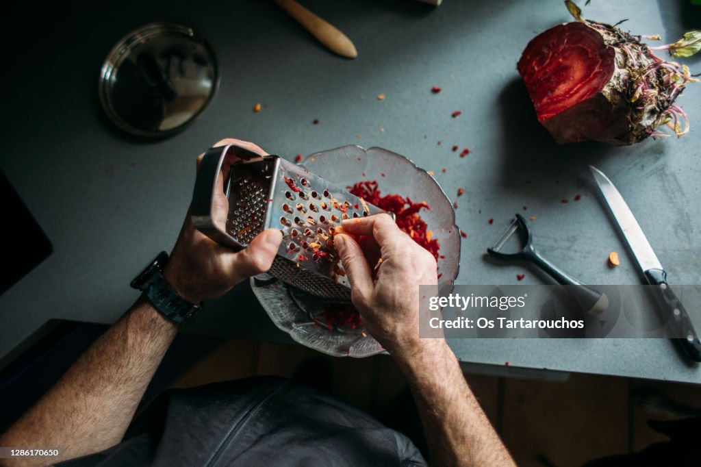 Man hand scratching beet