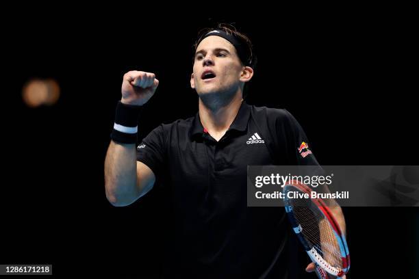 Dominic Thiem of Austria celebrates winning match point during his singles match against Rafael Nadal of Spain during day three of the Nitto ATP...