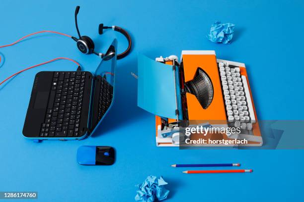 digital and analog – laptop and 70s typewriter - analog stock pictures, royalty-free photos & images