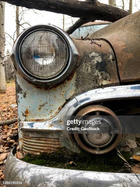 abandoned vintage car at old farm - stock photo car chrome bumper stock-fotos und bilder