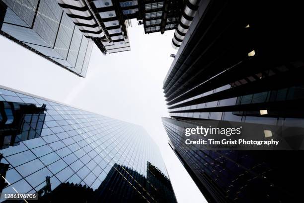 directly below shot of modern skyscrapers in the city of london - brexit uncertainty stock pictures, royalty-free photos & images