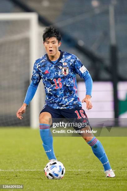 Takehiro Tomiyasu of Japan runs with the ball during the international friendly match between Japan and Mexico at Merkur Arena on November 17, 2020...