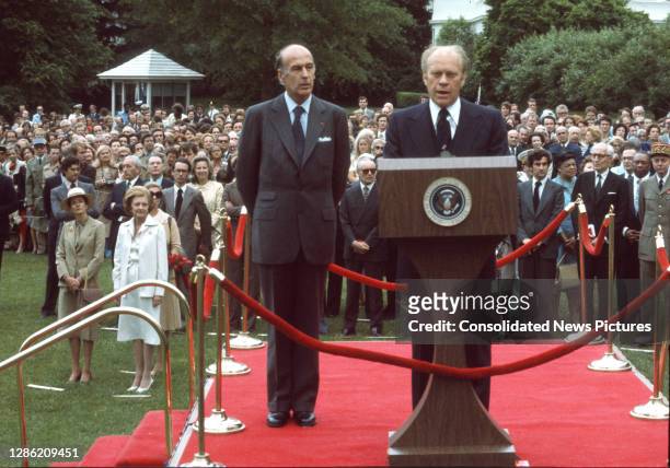 French President Valery Giscard d'Estaing listens as US President Gerald Ford welcomes him to the White House during a State Visit, Washington DC,...
