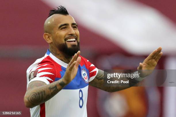 Arturo Vidal of Chile celebrates after scoring the first goal of his team during a match between Venezuela and Chile as part of South American...