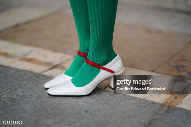 Gabriella Berdugo wears green wool tights / leggings, white squared heels pointy shoes from Prada, on November 17, 2020 in Paris, France.