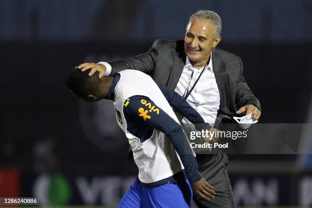 Tite head coach of Brazil congratulates Vinicius Junior of Brazil after a match between Uruguay and Brazil as part of South American Qualifiers for...