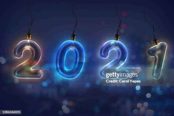 new year 2021 in neon lights - calendario español fotografías e imágenes de stock