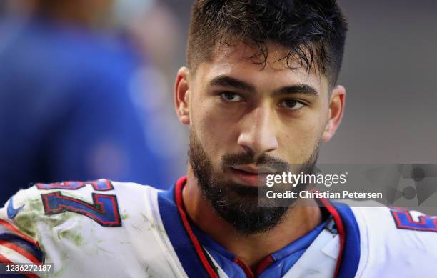 Defensive end A.J. Epenesa of the Buffalo Bills leaves the game with an injury during the NFL game against the Arizona Cardinals at State Farm...