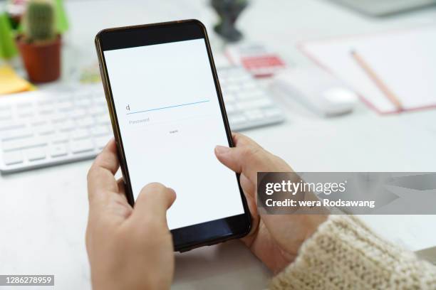 using mobile phone to login an account in to social media connect with friends - entering data stock pictures, royalty-free photos & images