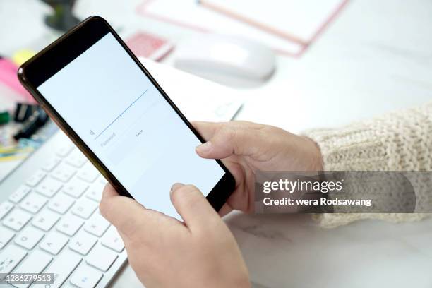 using mobile phone to login an account in to social media connect with friends - password stock pictures, royalty-free photos & images