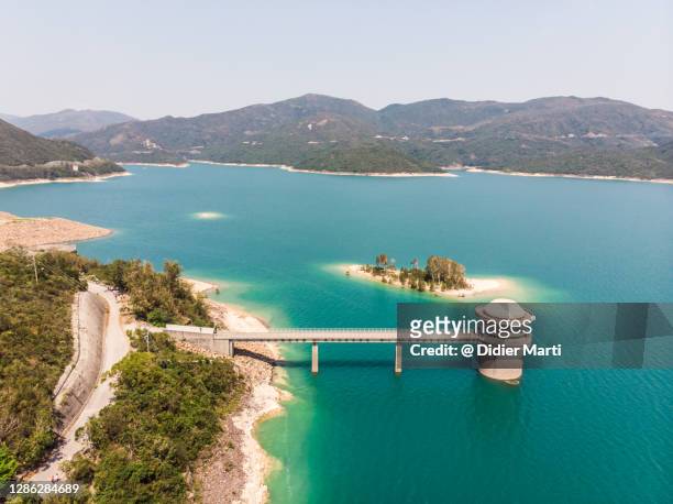 aerial view of the high island reservoir in sai kung in the new territories in hong kong - sai kung village stock-fotos und bilder
