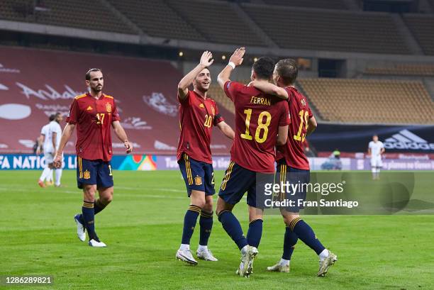 Ferran Torres of Spain celebrates scoring his team's fifth goal with team mates during the UEFA Nations League group stage match between Spain and...