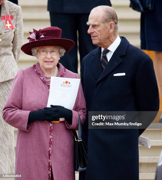 Queen Elizabeth II and Prince Philip, Duke of Edinburgh attend a dedication ceremony for the new Armed Forces Memorial at the National Memorial...