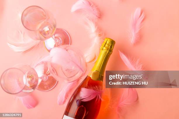 celebration with champagne bottle and glasses, romance, celebration - new pink background stock pictures, royalty-free photos & images