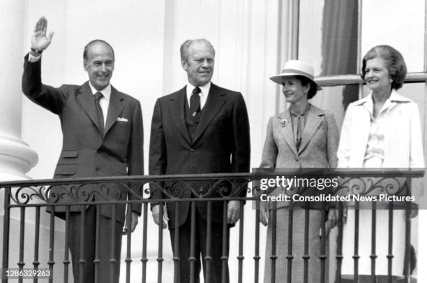 French President Valery Giscard d'Estaing waves as he stands with US President Gerald Ford during a State Visit to the White House, Washington DC,...