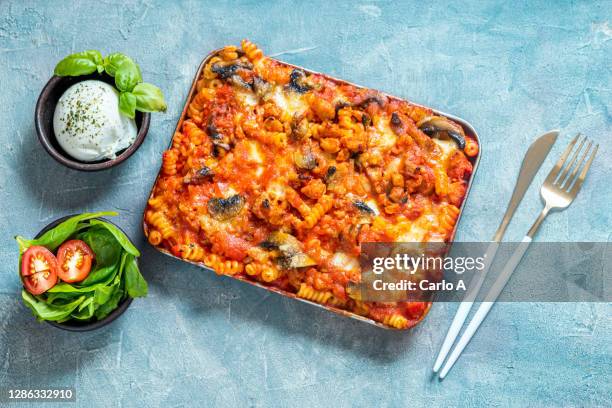 baked pasta spirals with tomato sauce, ground beef, mushrooms  and cheese - macaroni stock pictures, royalty-free photos & images