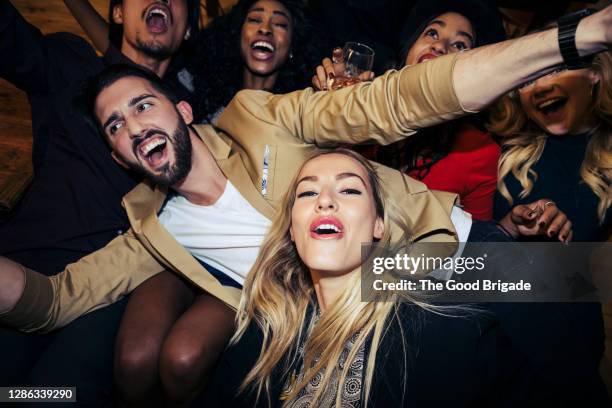 portrait of happy young woman with friends enjoying at party - cool house stock pictures, royalty-free photos & images