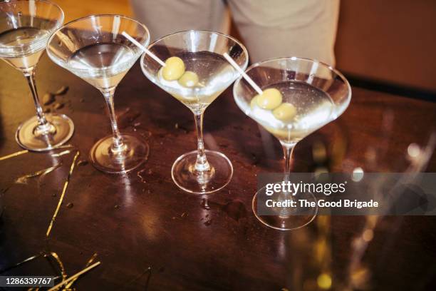 high angle view martini on table during party - martini stock pictures, royalty-free photos & images
