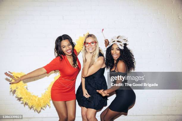 female friends having fun at party - woman in cocktail dress stock pictures, royalty-free photos & images