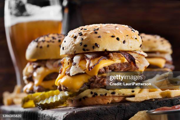 double cheese burger sliders with fried onions, pickles on a brioche sesame seed bun - messy top bun stock pictures, royalty-free photos & images