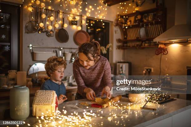 it's time for christmas cookies - kids cooking christmas stock pictures, royalty-free photos & images