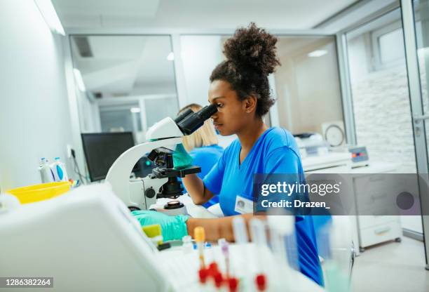 Black Using Microscope 1,932 Black Woman Microscope Stock Photos, High-Res Pictures, and ...