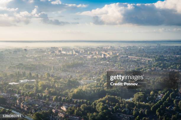 sunrise over amsterdam - amsterdam aerial stock pictures, royalty-free photos & images