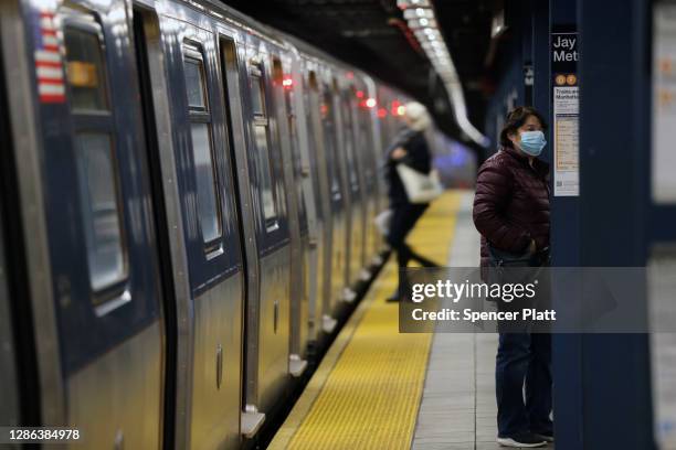 Subway arrives at a Brooklyn station on November 18, 2020 in New York City. In a bid to save $1.2 billion, the Metropolitan Transportation Authority...