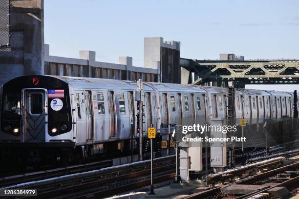 Subway arrives at a Brooklyn station on November 18, 2020 in New York City. In a bid to save $1.2 billion, the Metropolitan Transportation Authority...