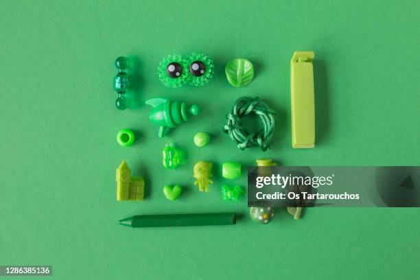 flay lay green tiny items knolling - monochrome green stock pictures, royalty-free photos & images