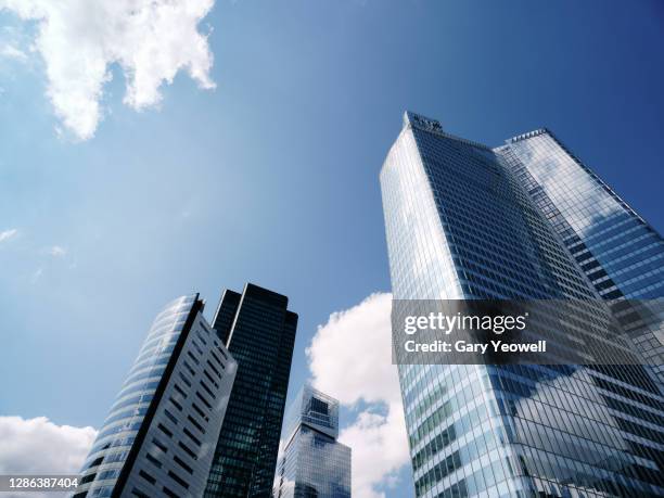 low angle view of skyscraper in la defense - vanishing point modern stock pictures, royalty-free photos & images