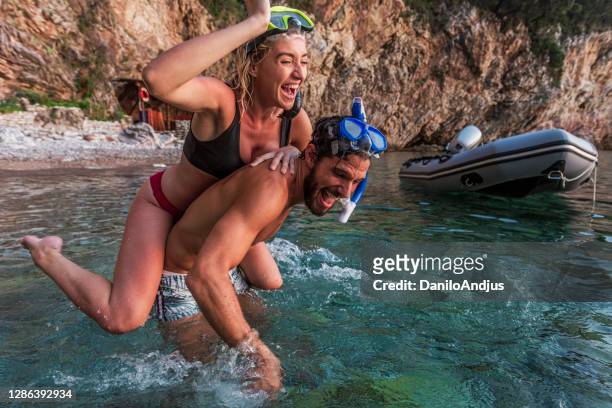 romantic couple goes snorkeling - desire stock pictures, royalty-free photos & images