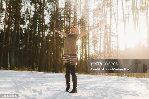 portrait of a beautiful girl in a snowy forest.woman in winter park. soft focus