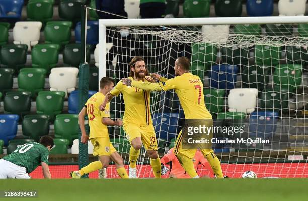Eric Bicfalvi of Romania celebrates with Denis Alibec and Florin Tanase after scoring their team's first goal during the UEFA Nations League group...