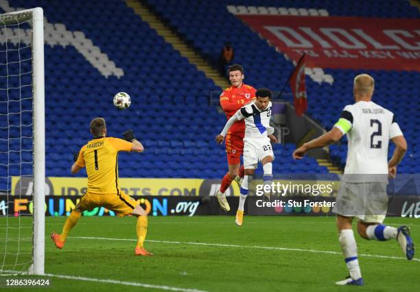 Kieffer Moore of Wales scores their team's third goal past Lukas Hradecky of Finland during the UEFA Nations League group stage match between Wales...