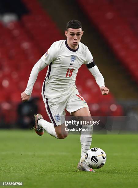 Phil Foden of England runs with the ball during the UEFA Nations League group stage match between England and Iceland at Wembley Stadium on November...