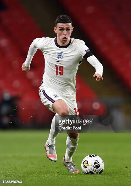 Phil Foden of England runs with the ball during the UEFA Nations League group stage match between England and Iceland at Wembley Stadium on November...