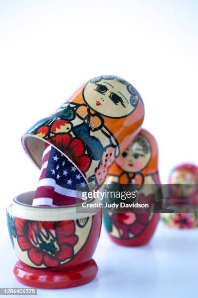 russian nesting dolls filled with an american flag - anticommunist stock pictures, royalty-free photos & images